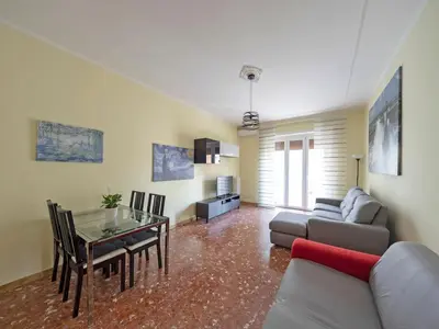 a living room with a table and a couch at Welcome to Pigneto in Rome