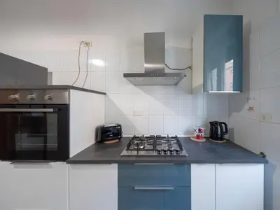 a kitchen with a stove top oven in a kitchen at Welcome to Pigneto in Rome