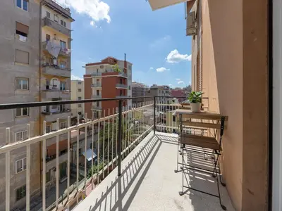 a balcony with a bench and a view of a city at Welcome to Pigneto in Rome