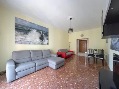a living room with a couch and a table at Welcome to Pigneto in Rome