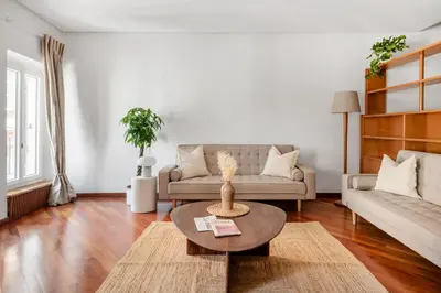 a living room with a couch and a table at Leonina Art Loft in Rome