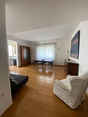 a living room with a couch and a table at Nina House Roma in Rome
