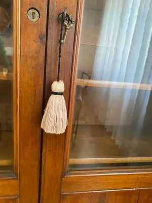 a tassel hanging from a door with a window at Nina House Roma in Rome