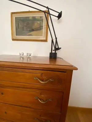 a desk lamp on top of a dresser at Nina House Roma in Rome