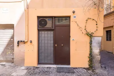 a building with a heart on the side of a street at Valentina's studio in Rome