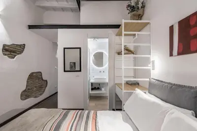 a small kitchen with a table and a table and a table at Valentina's studio in Rome