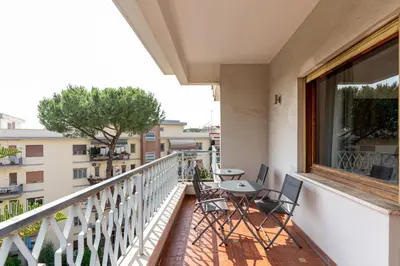 a balcony with chairs and a table and a window at Hill Houses - art & stay - Rome in Rome