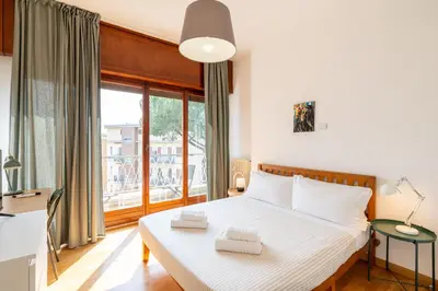 a bedroom with a bed with two towels on it at Hill Houses - art & stay - Rome in Rome