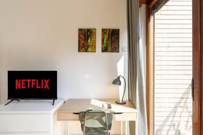 an office with a desk with a television on it at Hill Houses - art & stay - Rome in Rome