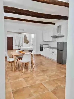 a kitchen and dining room with a table and chairs at Casa Bonosa in the Heart of Rome CISE 25369 in Rome