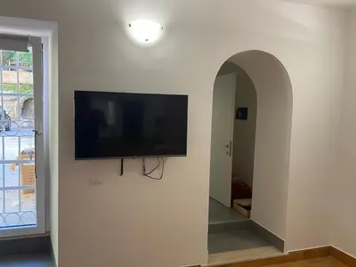 a flat screen tv on a wall in a hallway at Casa Bonosa in the Heart of Rome CISE 25369 in Rome