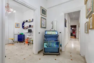 a room with a video game system in the middle of it at Holiday Jeans Apartment in Rome