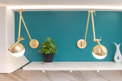 a shelf with goldoons and a blue wall at Tiburtina Station Rooftop Angel Joy with Private Terrace - Superattico con Terrazzo privato in Rome