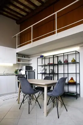 a dining room with a table and chairs in a kitchen at Rome, very central 2 bedrooms 4 beds in Rome