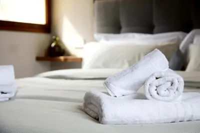 a pile of towels sitting on top of a bed at Rome, very central 2 bedrooms 4 beds in Rome