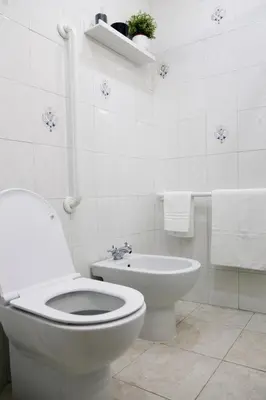 a white bathroom with a toilet and a bidet at Rome, very central 2 bedrooms 4 beds in Rome