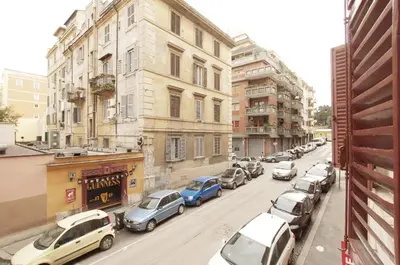 a city street filled with parked cars and buildings at Ostilia Loft in Rome
