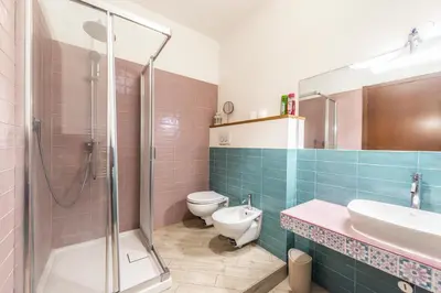 a bathroom with a shower and a toilet and a sink at The Bright Marajà Roma Centro Luxury Boutique Retreat in Rome