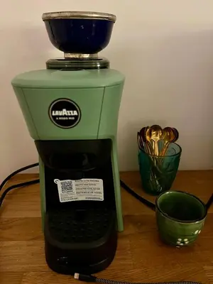 a green coffee maker with a bowl on top of it at The Bright Marajà Roma Centro Luxury Boutique Retreat in Rome