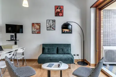 a living room with a couch and a table and chairs at VaticanRhome I in Rome