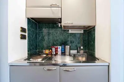 a kitchen with a sink and a counter top at Romantic in Rome