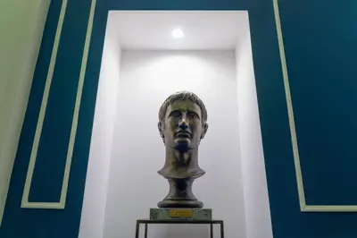 a bust of a man on a table in a room at Corso Boutique Luxury Rooms in Rome