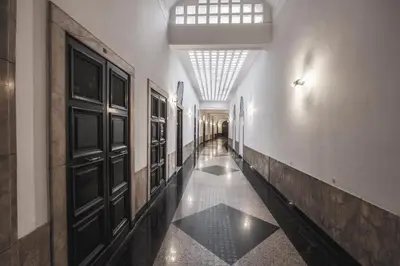 a hallway of a building with a door and a hallwayngth at Corso Boutique Luxury Rooms in Rome