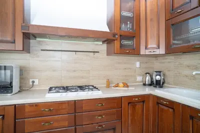 a kitchen with a stove top oven next to a sink at Stile e spazio nel cuore di Roma in Rome