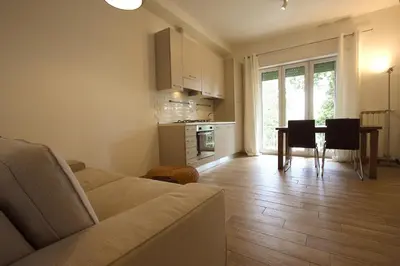 a living room with a couch and a table at Inventori Tevere Suite in Rome