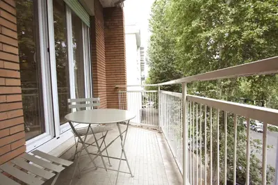a table on the balcony of a house at Inventori Tevere Suite in Rome