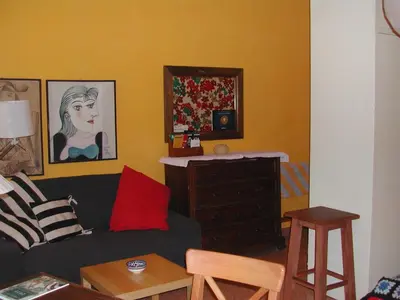 a living room with a couch and a dresser at Appartamento del Boschetto in Rome