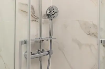 a shower with a shower head in a bathroom at Appartamento Campo Marzio Lusso in Rome
