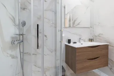 a bathroom with a shower and a sink at Appartamento Campo Marzio Lusso in Rome