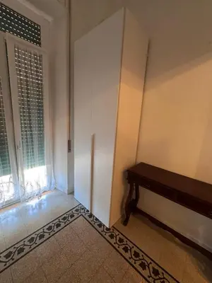 a room with a bench next to a window at Hanna's House Metro Pyramid in Rome