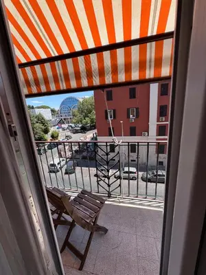 a balcony with a bench and a view of a building at Hanna's House Metro Pyramid in Rome