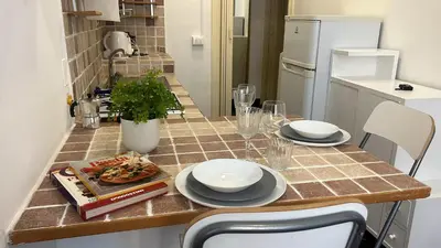 a kitchen with a table with plates of food on it at Colosseo Promenade in Rome