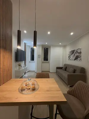 a living room with a table with donuts on it at Gianvenuti House Rome - Metro A with Jacuzzi in Rome