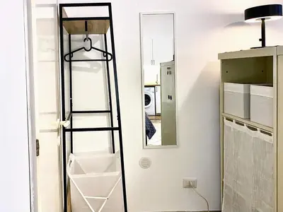 a room with a ladder and a mirror at Karma Trastevere Loft in Rome