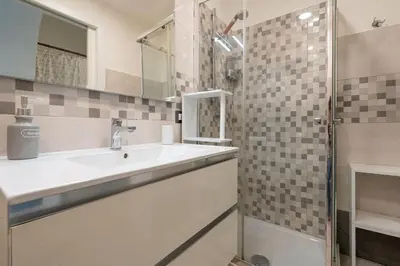 a bathroom with a sink and a shower at lollo's home in Rome