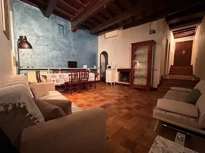 a living room with couches and a table and chairs at The Father s House in Rome