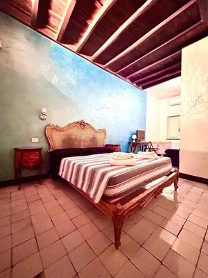 a bedroom with a large bed in a room at The Father s House in Rome