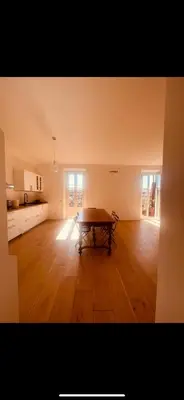 a room with a table in the middle of a kitchen at Interno 12 in Rome