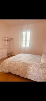 a kitchen with a table in the middle of a room at Interno 12 in Rome