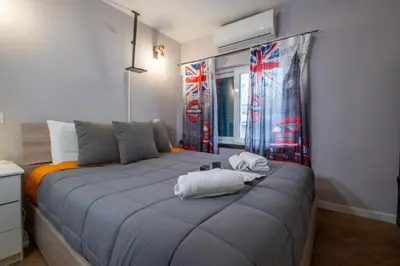 a bedroom with a bed with two towels on it at ht movie flat bilo in Rome