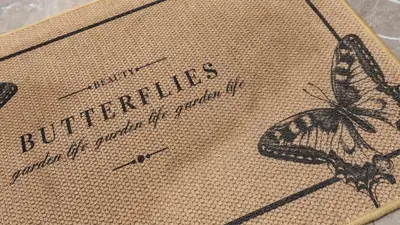 a butterfly is sitting on a piece of burlap at Rosina's House in Rome