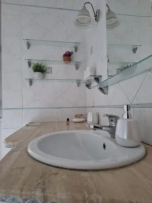 a bathroom with a sink and a mirror at Raffa al Pigneto in Rome