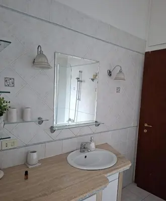 a bathroom with a sink and a mirror at Raffa al Pigneto in Rome