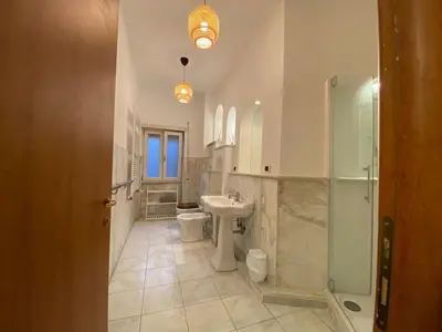 a bathroom with a sink and a toilet and a shower at Ripa di Trastevere in Rome