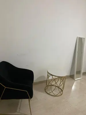 a black chair and a table in a room at Scalia gest in Rome