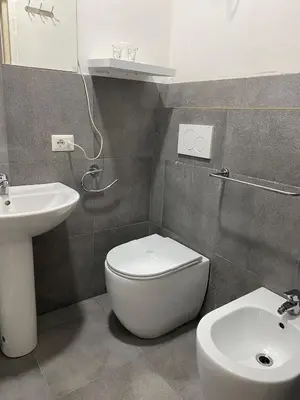 a bathroom with a white toilet and a sink at Scalia gest in Rome